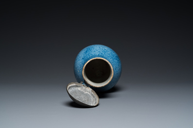 A monochrome blue Brussels faience jug with pewter cover, 18th C.
