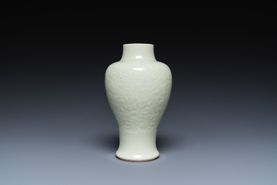 A Chinese celadon-glazed vase with underglaze floral design, Kangxi
