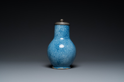 A monochrome blue Brussels faience jug with pewter cover, 18th C.