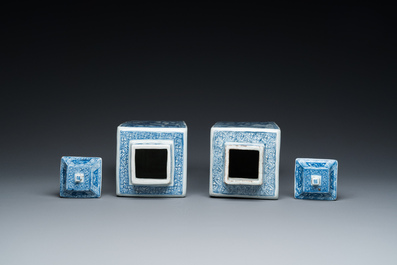 A pair of Chinese blue and white square 'narrative subject' vases and covers, Kangxi