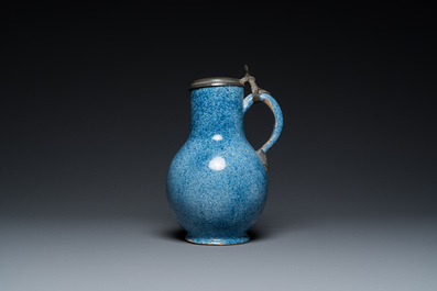 A monochrome blue Brussels faience jug with pewter cover, 18th C.