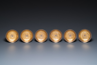 Eleven Chinese PM-monogrammed gilt-ground saucers and ten cups, Yongzheng/Qianlong