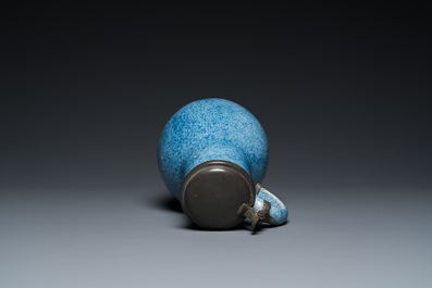 A monochrome blue Brussels faience jug with pewter cover, 18th C.