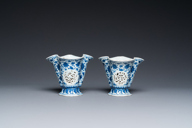 A pair of Chinese reticulated and double-walled blue and white Ming-style beakers with lotus scrolls, Qianlong