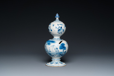 A Dutch Delft blue and white double gourd money bank with a deer hunt, dated 1732