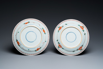 A pair of Chinese famille verte plates with a bird above a peony bush, Kangxi