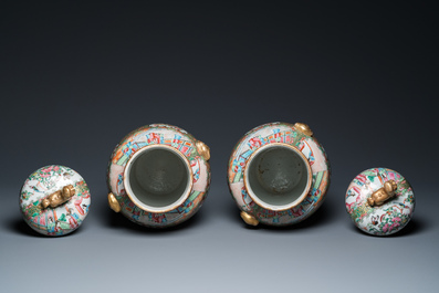 A pair of Chinese Canton famille rose vases and covers, 19th C.
