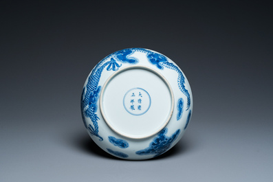 A Chinese blue and white plate with a dragon chasing the flaming pearl, Yongzheng mark and of the period