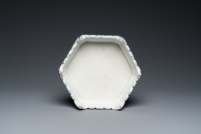 A rare Chinese famille rose hexagonal 'antiquities' stand, Yongzheng