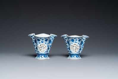 A pair of Chinese reticulated and double-walled blue and white Ming-style beakers with lotus scrolls, Qianlong