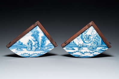 A pair of rare Dutch Delfware blue and white corner or quadrant tiles with biblical scenes, Amsterdam, 1st half 18th C.