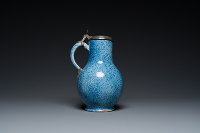 A monochrome blue Brussels faience jug with pewter cover, 18th C.