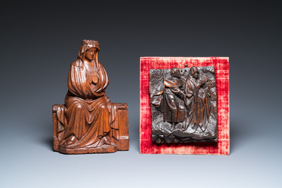 A carved oak figure of a seated Mary and a panel with Saint John and Mary, Flanders and/or Northern France, 15/16th C.
