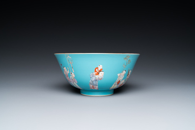 A Chinese famille rose bowl with playing boys on a turquoise ground, Qianlong mark, 20th C.