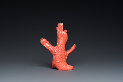 A Chinese red coral group of a standing prince on a dragon, 19/20th C.