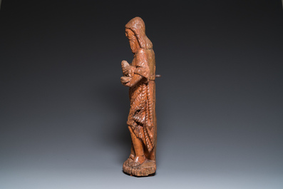 A large carved oak sculpture of John the Baptist holding the Lamb, 16th C.