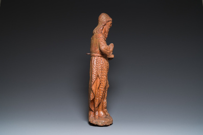 A large carved oak sculpture of John the Baptist holding the Lamb, 16th C.