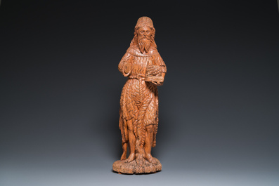 A large carved oak sculpture of John the Baptist holding the Lamb, 16th C.