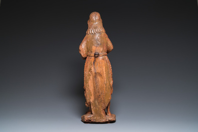 A large carved oak sculpture of John the Baptist holding the Lamb, 16th C.