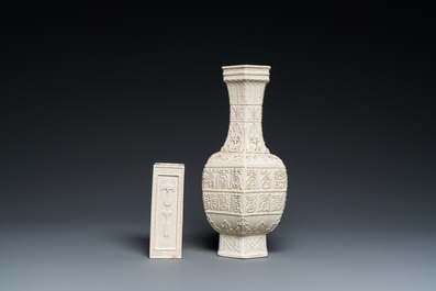 A Chinese relief-molded monochrome cream-glazed crackle-ground vase and a brush pot, Qing