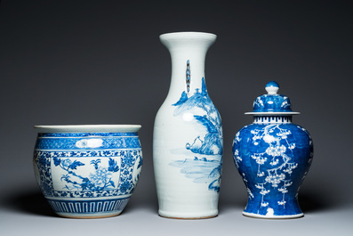 A Chinese blue and white 'landscape' vase, a covered vase and a jardini&egrave;re, 19th C.