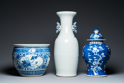 A Chinese blue and white 'landscape' vase, a covered vase and a jardini&egrave;re, 19th C.