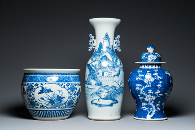 A Chinese blue and white 'landscape' vase, a covered vase and a jardini&egrave;re, 19th C.