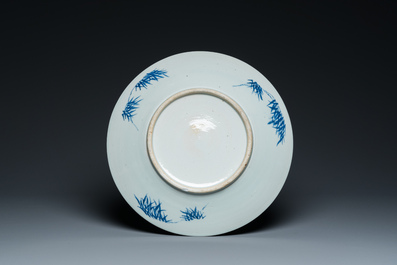 A Chinese blue and white dish and ten plates, 19th C.