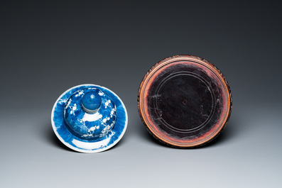 A Chinese blue and white 'landscape' vase, a covered vase and a jardini&egrave;re, 19th C.