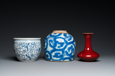 Three Chinese blue and white vases and a monochrome red vase, 19th C.