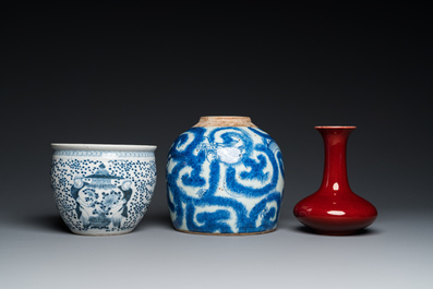 Three Chinese blue and white vases and a monochrome red vase, 19th C.
