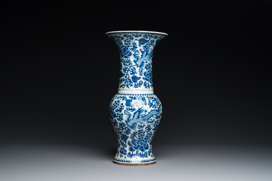 Three Chinese blue and white vases and a monochrome red vase, 19th C.