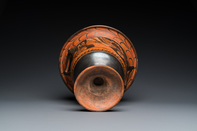 A Greek Apulian red figure bell krater with a winged female and a lady's head, 4th C. b.C.