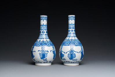 A pair of Chinese blue and white bottle vases, 19th C.