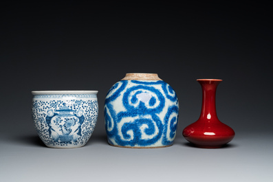 Three Chinese blue and white vases and a monochrome red vase, 19th C.