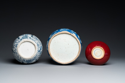 Three Chinese blue and white vases and a monochrome red vase, 19th C.