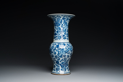 Three Chinese blue and white vases and a monochrome red vase, 19th C.