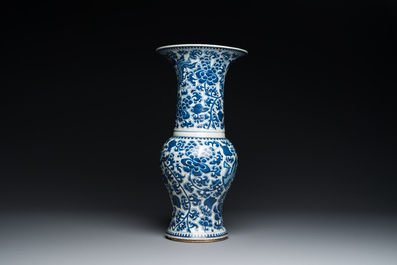 Three Chinese blue and white vases and a monochrome red vase, 19th C.