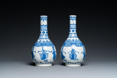 A pair of Chinese blue and white bottle vases, 19th C.