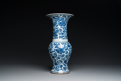 Three Chinese blue and white vases and a monochrome red vase, 19th C.