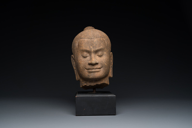 A Khmer stone head of Jayavarman VII in Bayon-style, Cambodia, probably 13th C.