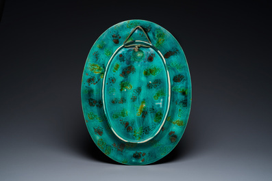 An oval Mintons majolica dish with a goddess with putto, England, year mark 1874