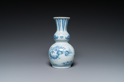 Two Dutch Delft blue and white chinoiserie vases and a deep salad bowl, 17/18th C.