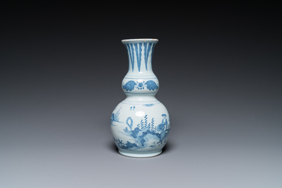 Two Dutch Delft blue and white chinoiserie vases and a deep salad bowl, 17/18th C.