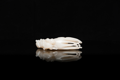 A Chinese white jade sculpture of a Buddha hand with monkeys, Qing