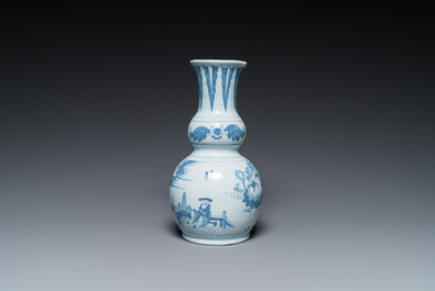 Two Dutch Delft blue and white chinoiserie vases and a deep salad bowl, 17/18th C.