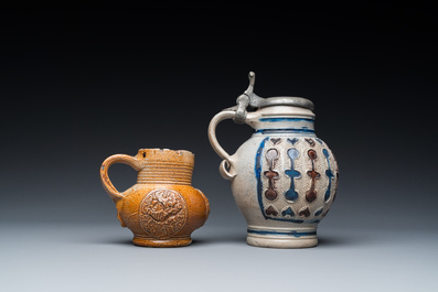 A stoneware armorial jug and a pewter-mounted jug, Raeren and Westerwald, 16/17th C.