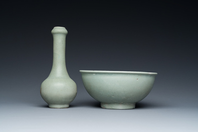 A Chinese celadon-glazed bottle vase and two bowls, Yuan/Ming