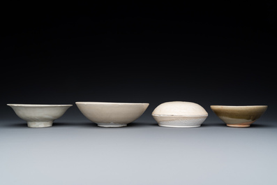 Three Chinese celadon- and qingbai-glazed bowls and a cream-glazed box and cover, Song and later
