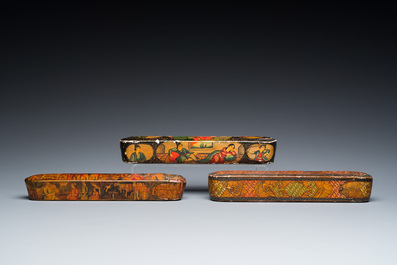 Three lacquered papier-mach&eacute; pen boxes or qalamdans, Qajar, Persia, 19th C.